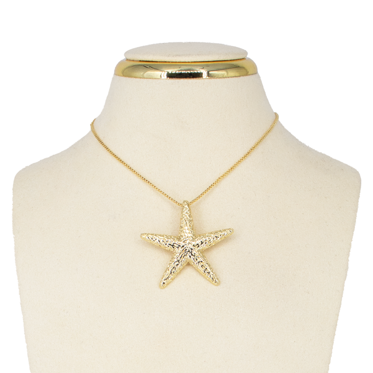 DIJE ESTRELLA TALLADA DORADO BAÑO EN RODIO