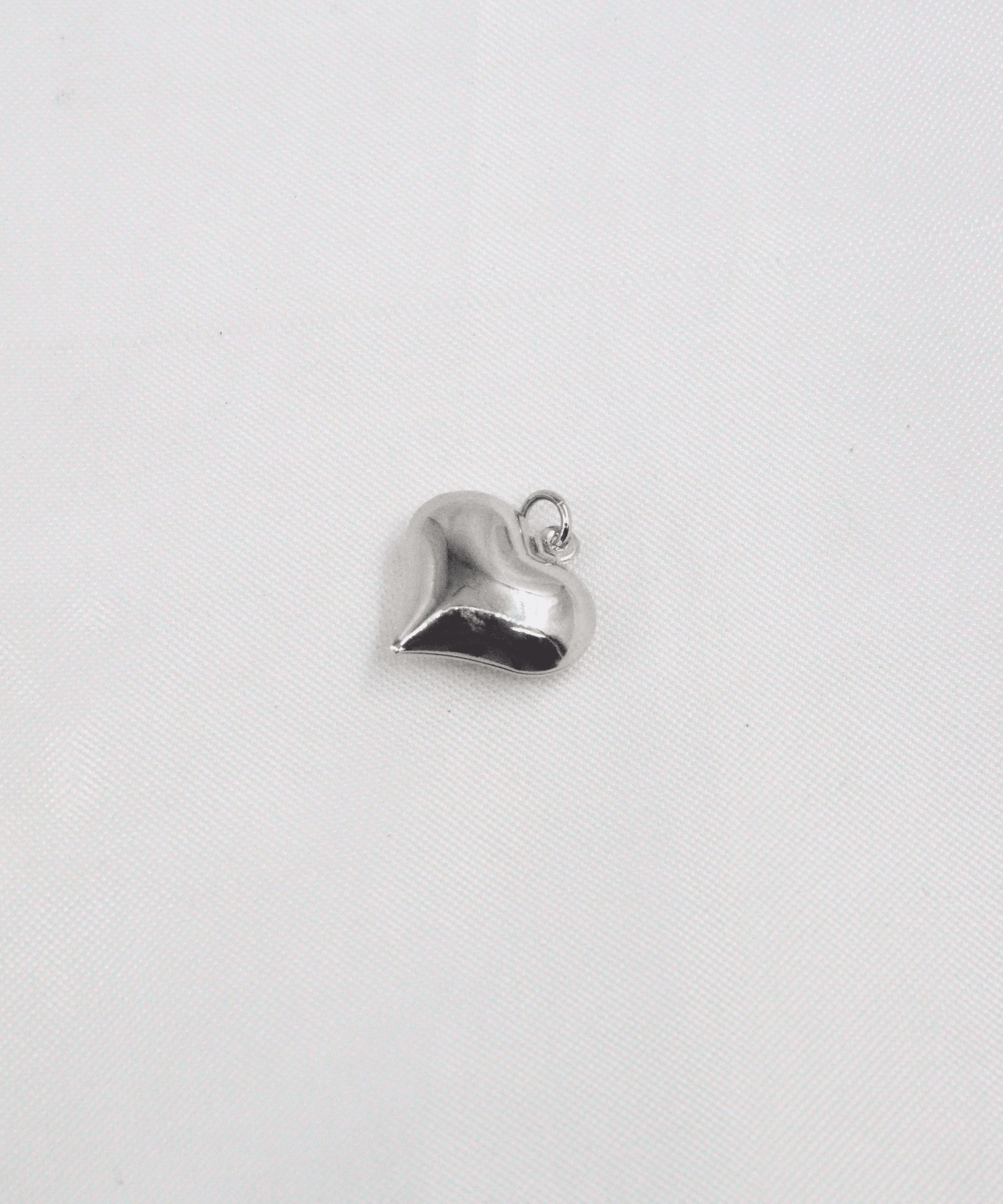 DIJE CORAZÓN MEDIANO LISO EN RODIO