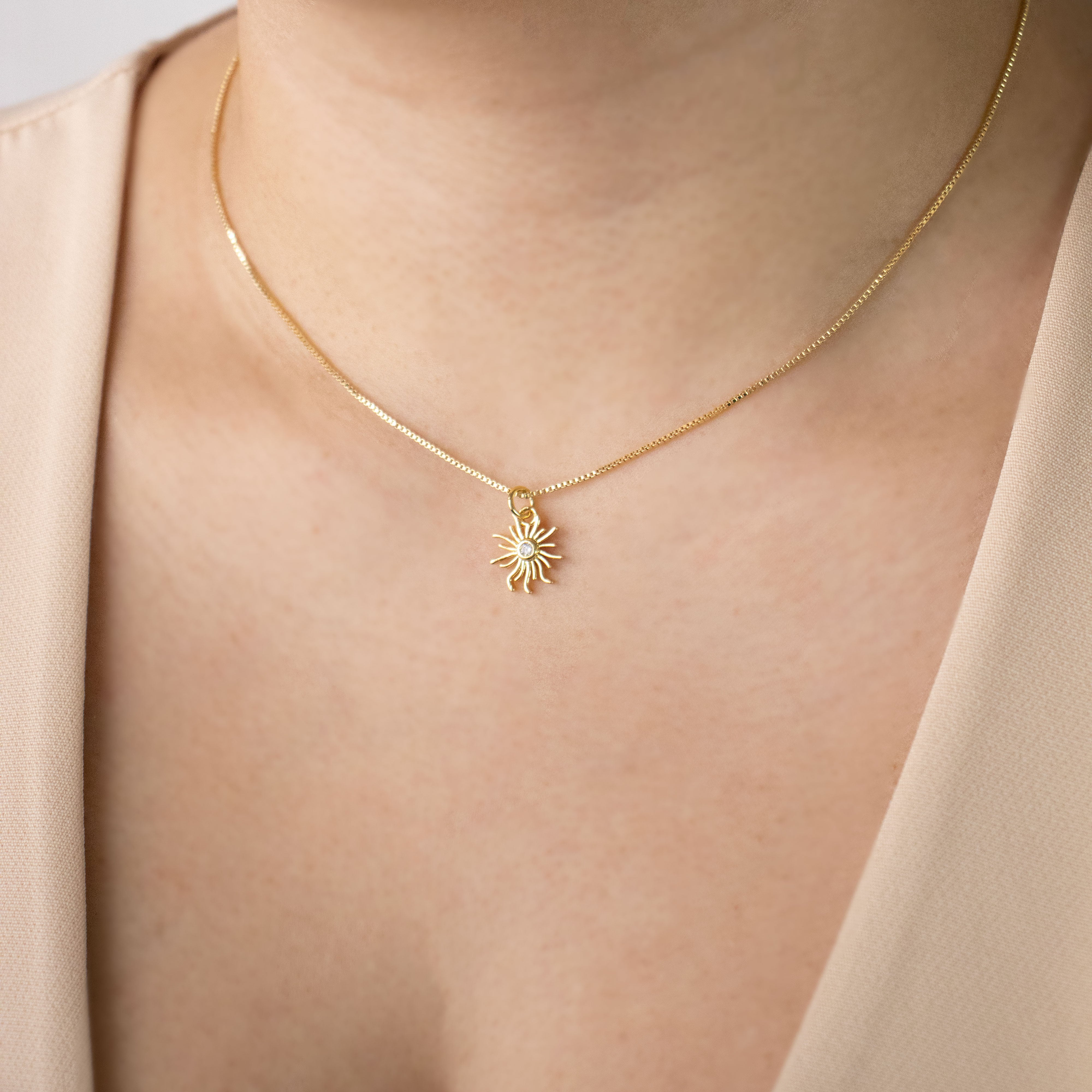 DIJE SOL CIRCON BAÑO EN RODIO