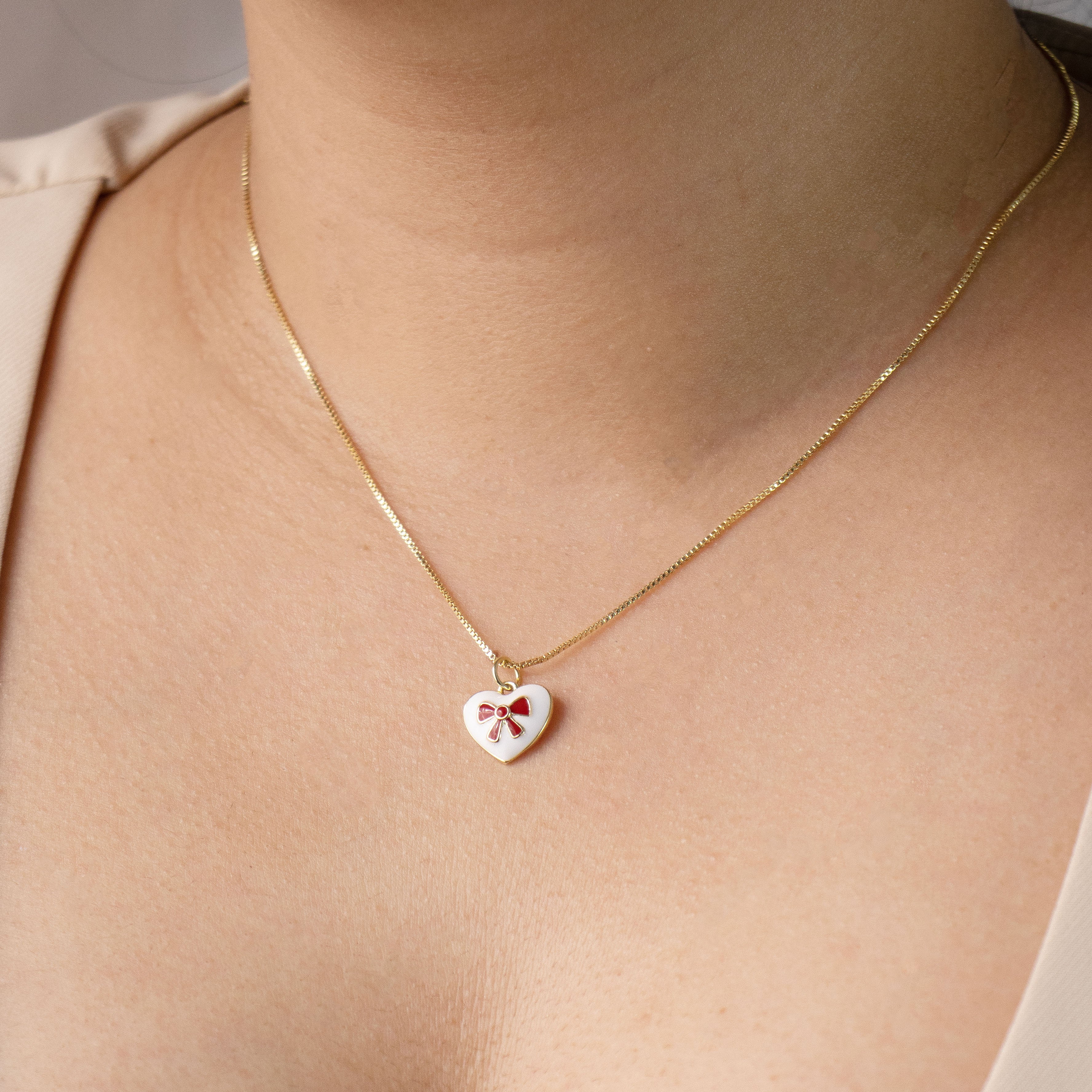 DIJE MOÑO CORAZON BAÑO EN RODIO