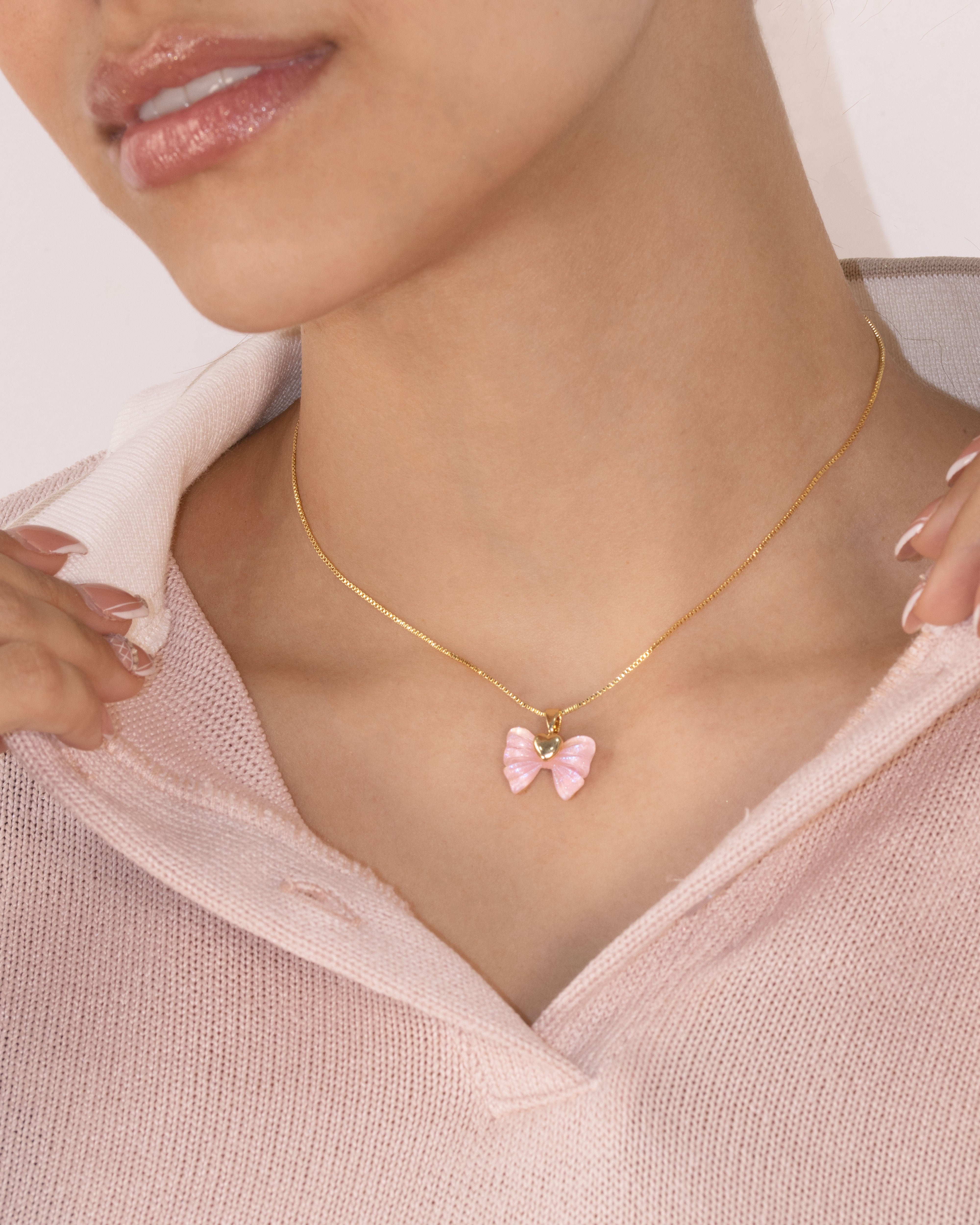 DIJE MOÑO ROSA BAÑO EN RODIO