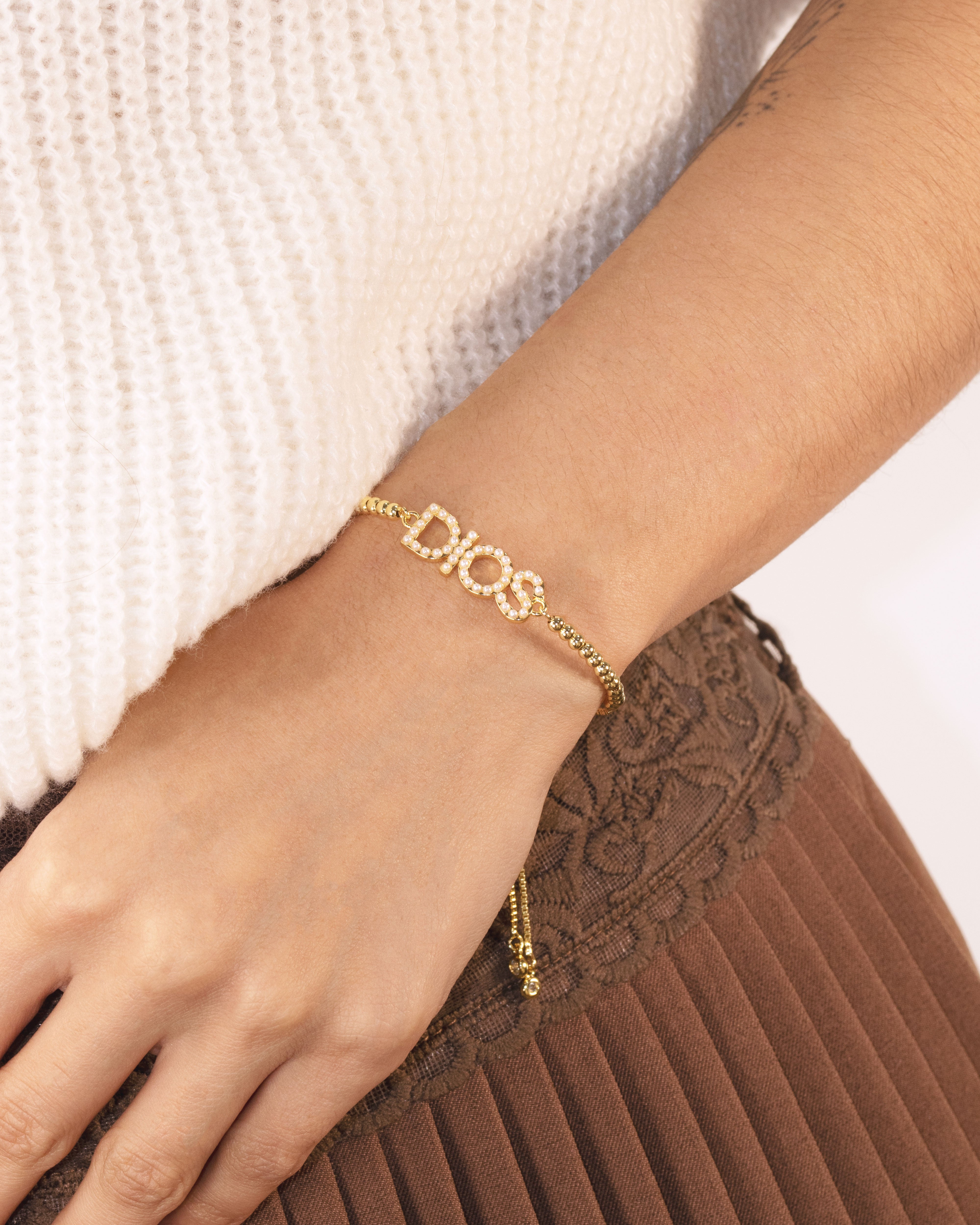 DIJE PULSERA DIOS PERLADO BAÑO EN RODIO