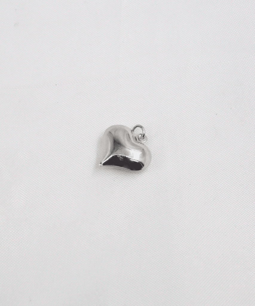 DIJE CORAZÓN MEDIANO LISO EN RODIO